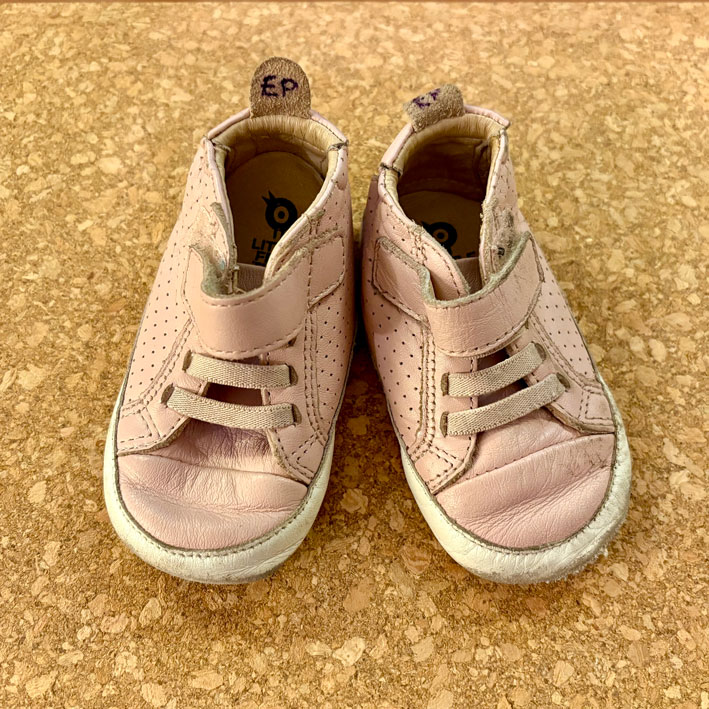 Child-sized pair of shoes.