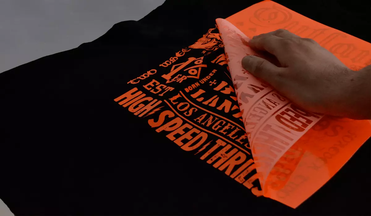 Heat transfer vinyl onto a T-shirt.